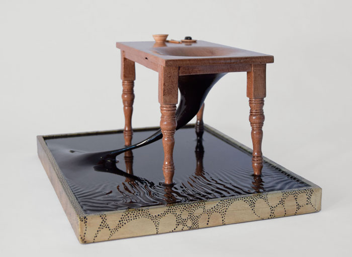  Sculpture of a table linked to the earth called Ouroboros by Bourdon Brindille