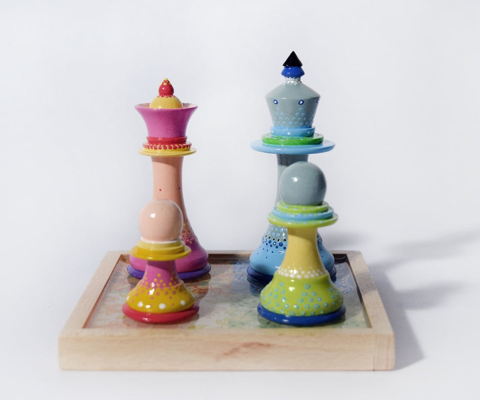 Colourful Painted Chess pieces as a Family Unit by Bourdon Brindille