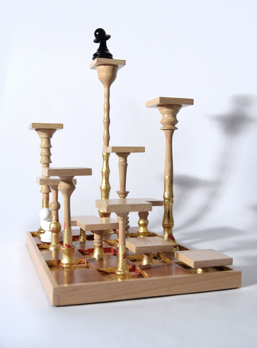 Wood sculputre based around chess entitled 