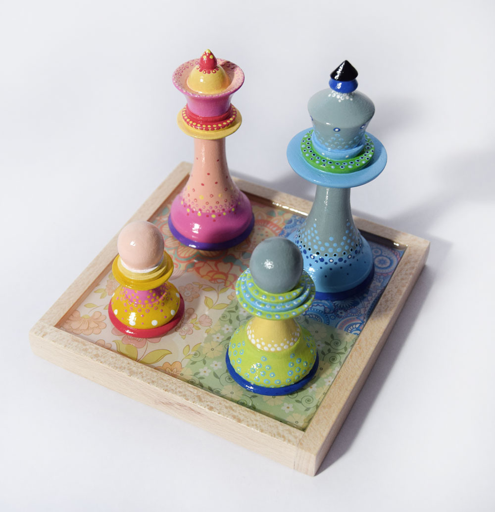 Colourful Painted Chess pieces as a Family Unit by Bourdon Brindille