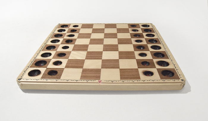 Chess Board with scorched places where pieces should be by Bourdon Brindille